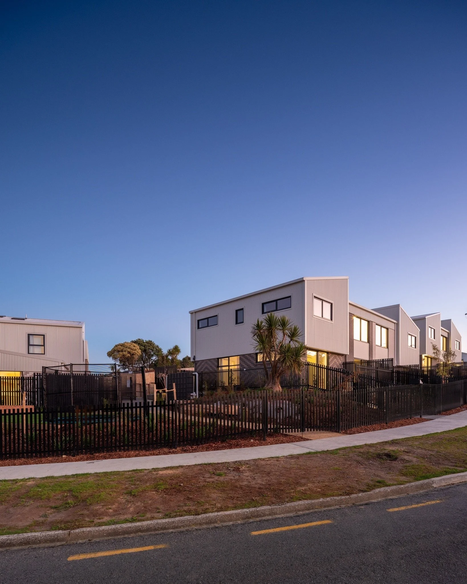 Te Āhuru Mōwai Townhouses | Tuki

Tuki is the second installment of a long term partnership between First Light Studio and Te Āhuru Mōwai, formally established in 2023. These ten homes delivered here form part of a broader programme of more than 50 n
