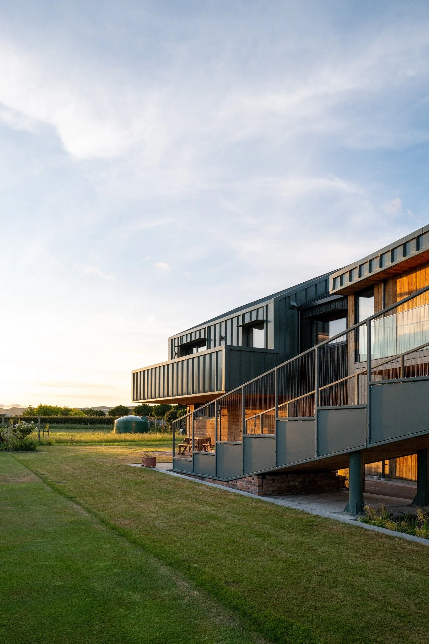 Craighall

Craighall's design masterfully blends rural barn and industrial vineyard aesthetics with the surrounding vernacular architecture. The buildings are strategically positioned to maximize passive solar performance and facilitate a seamless fl