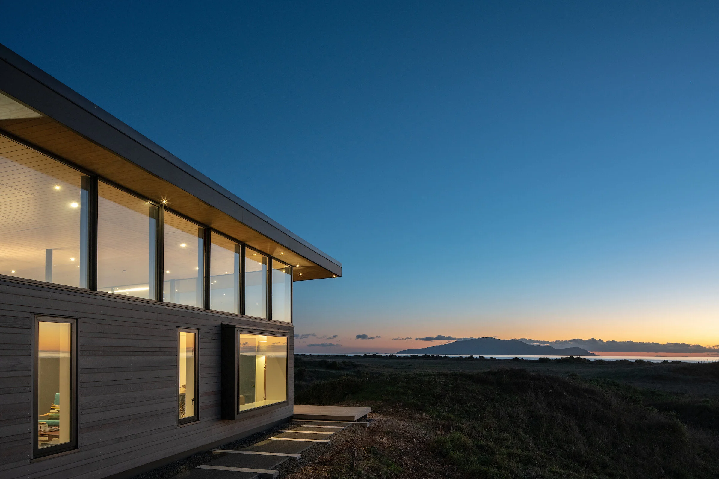 First Light Studio beach house with silver cladding responding to the coastal landscape