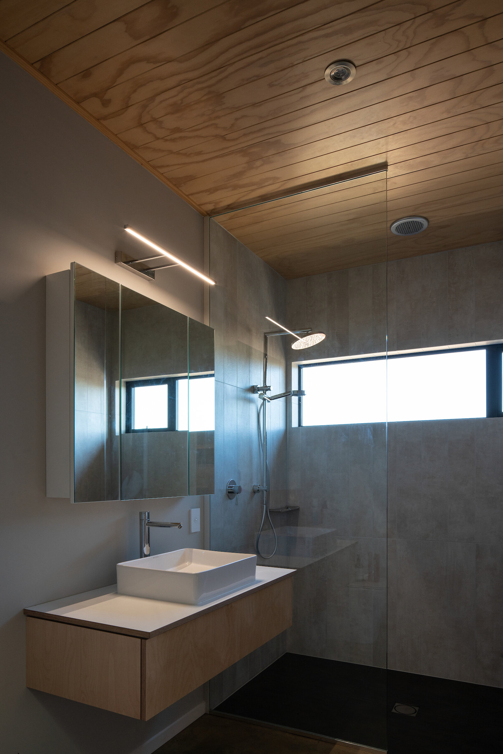 First Light Studio Te Horo Beach House bathroom with natural materials and muted tones