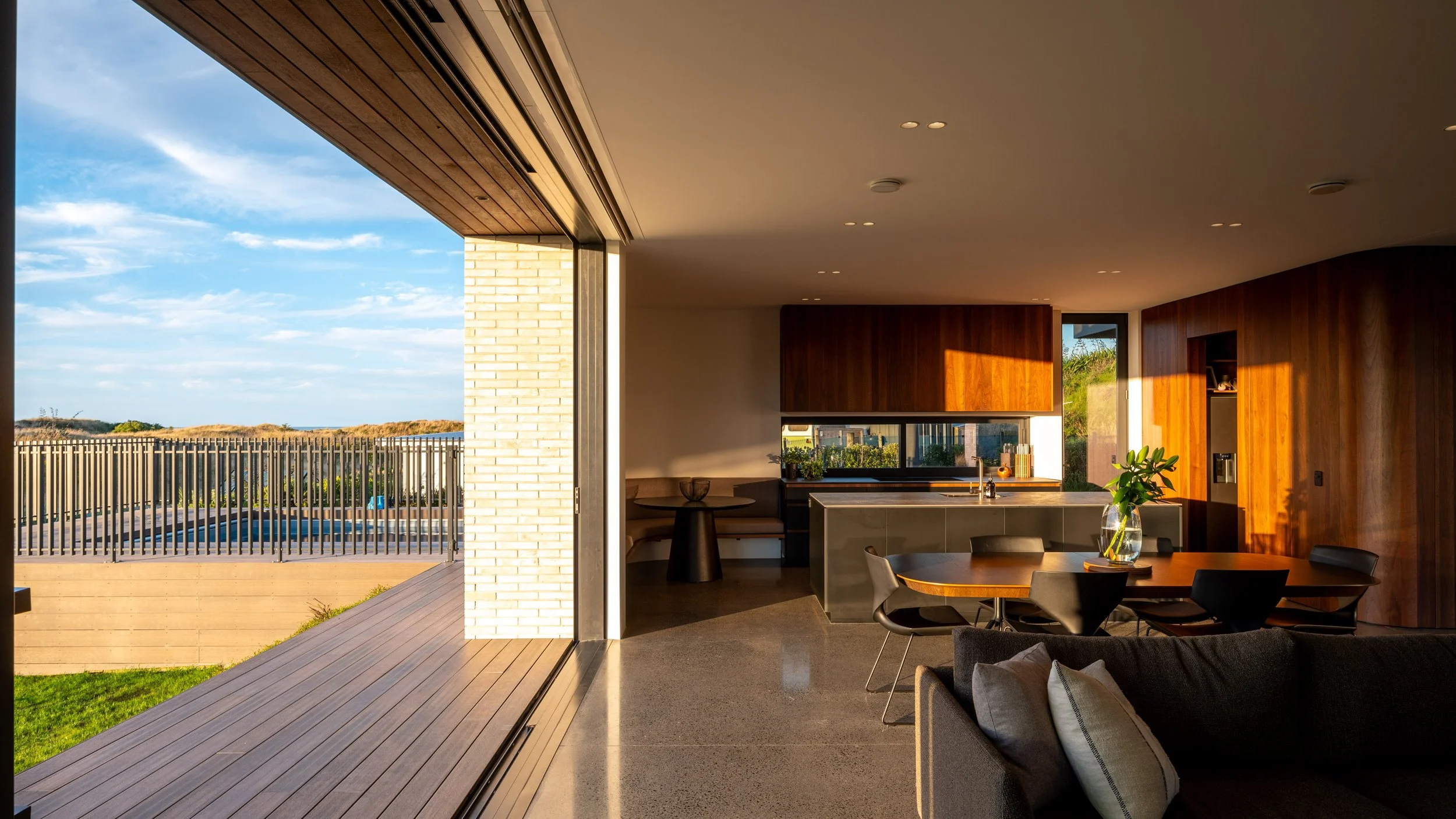 Indoor outdoor flow in beach house design by First Light Studio