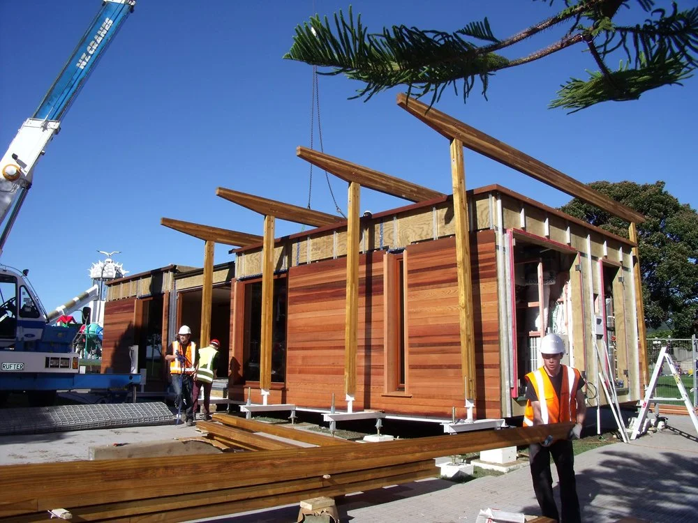 The First Light House Eco House Timber structure is assembled on the Wellington Waterfront