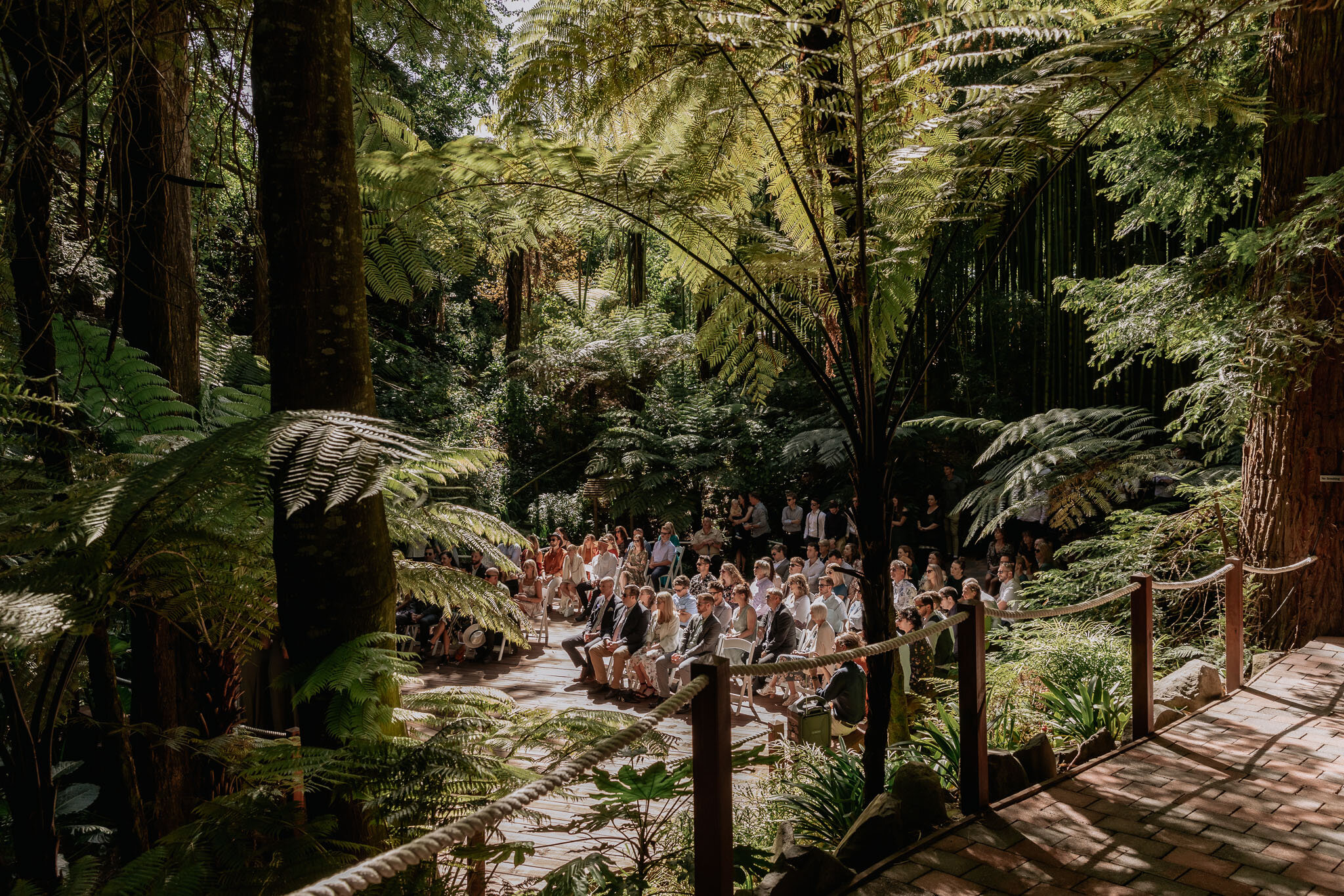 Guests seated at the wedding ceremony platform at Omahanui