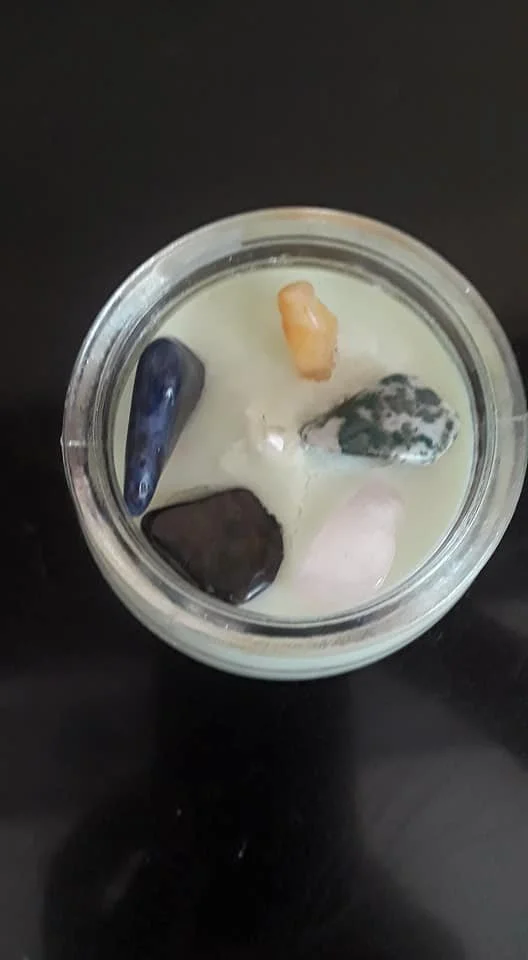 8 oz. candle with some of our specially selected crystals and stones tumbled over several weeks