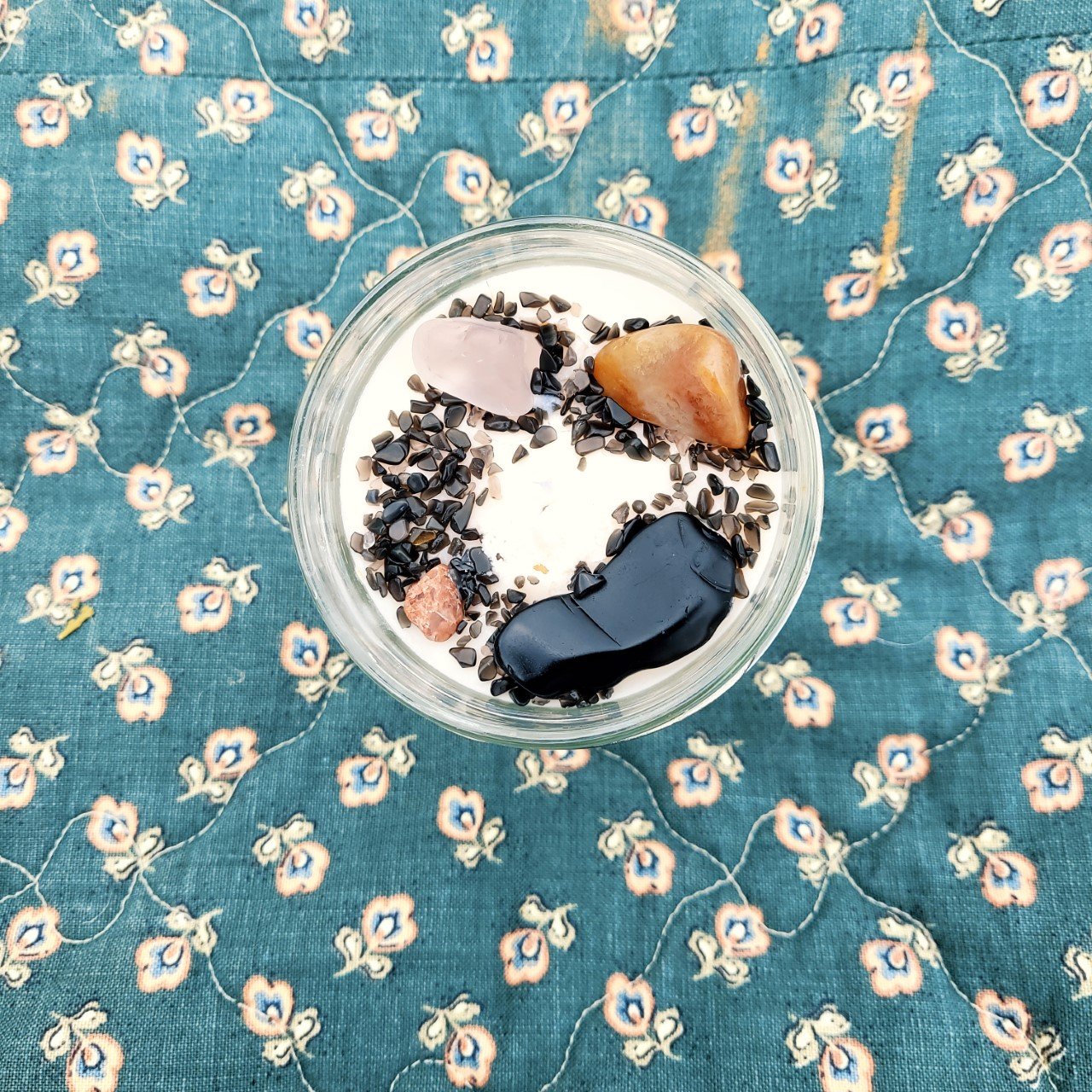 Protection candle with hand tumbled clear quartz, obsidian and other crystals and stones