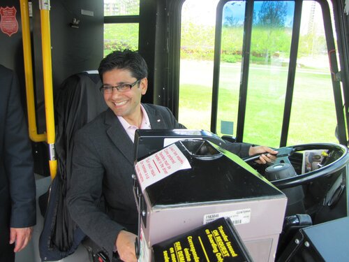 Yasir Naqvi riding public transportation in Ottawa Centre