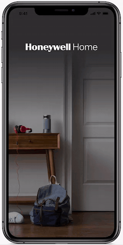 The Honeywell Home app on a smartphone, changing a thermostat's temperature