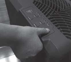Holding the power button for 3 seconds to reset the clean-unit indicator on a portable air purifier