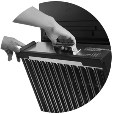 Two hands lifting the electronic cell out of an RPS series portable air purifier by its handle