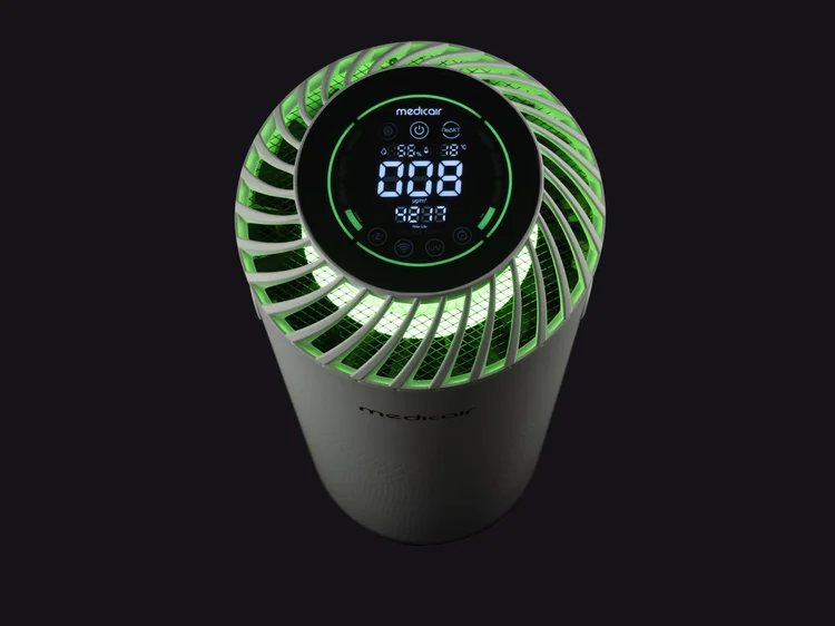 Top view of the MedicAir Pro with its round LED display lit, on a black background