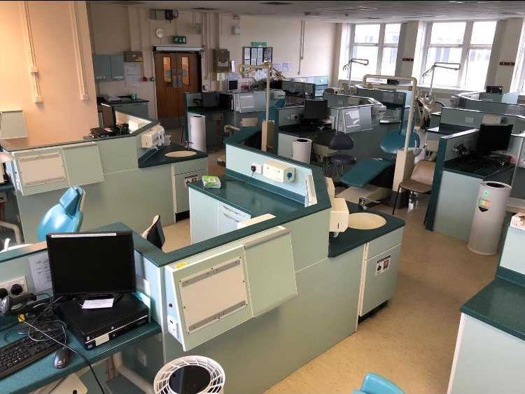MedicAir 1.0 air purifiers standing beside the dental chairs in the open teaching clinic at Cardiff's dental school