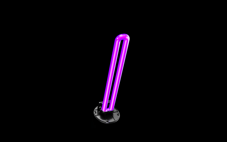 The MedicAir's 24 W UV-C lamp glowing violet on a black background
