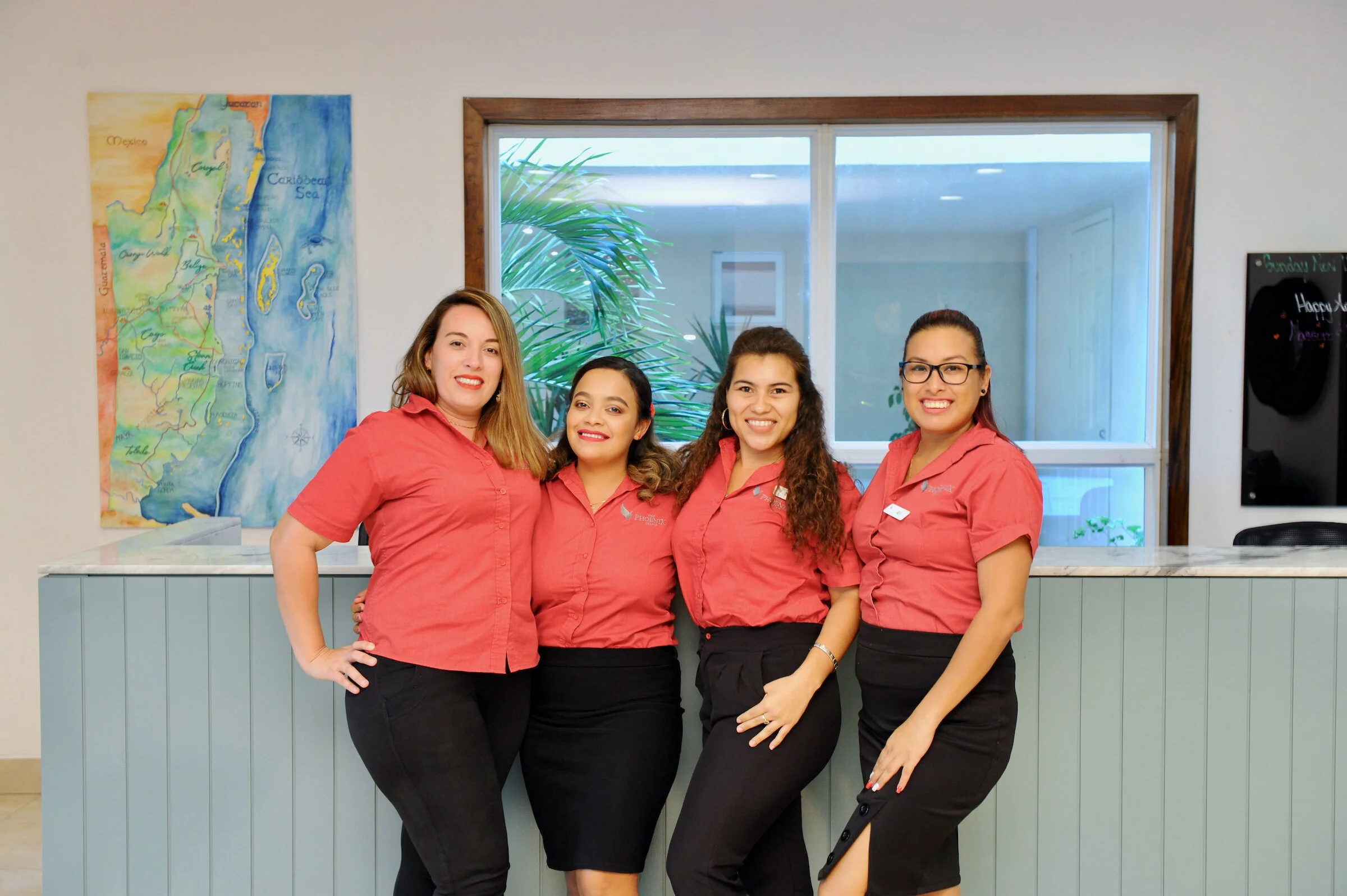 Our dedicated San Pedro service team at The Phoenix Resort, providing personalized hospitality and local expertise.