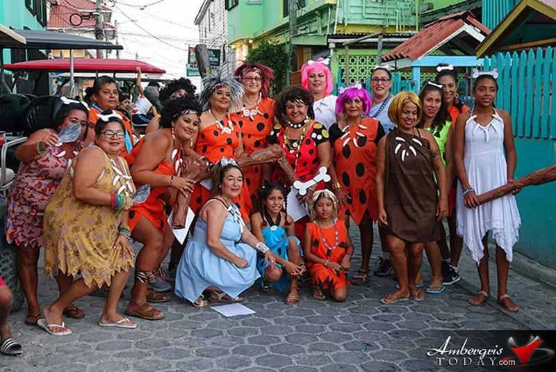 Traditional comparsas dancers in vibrant costumes during Carnaval in San Pedro, Belize.