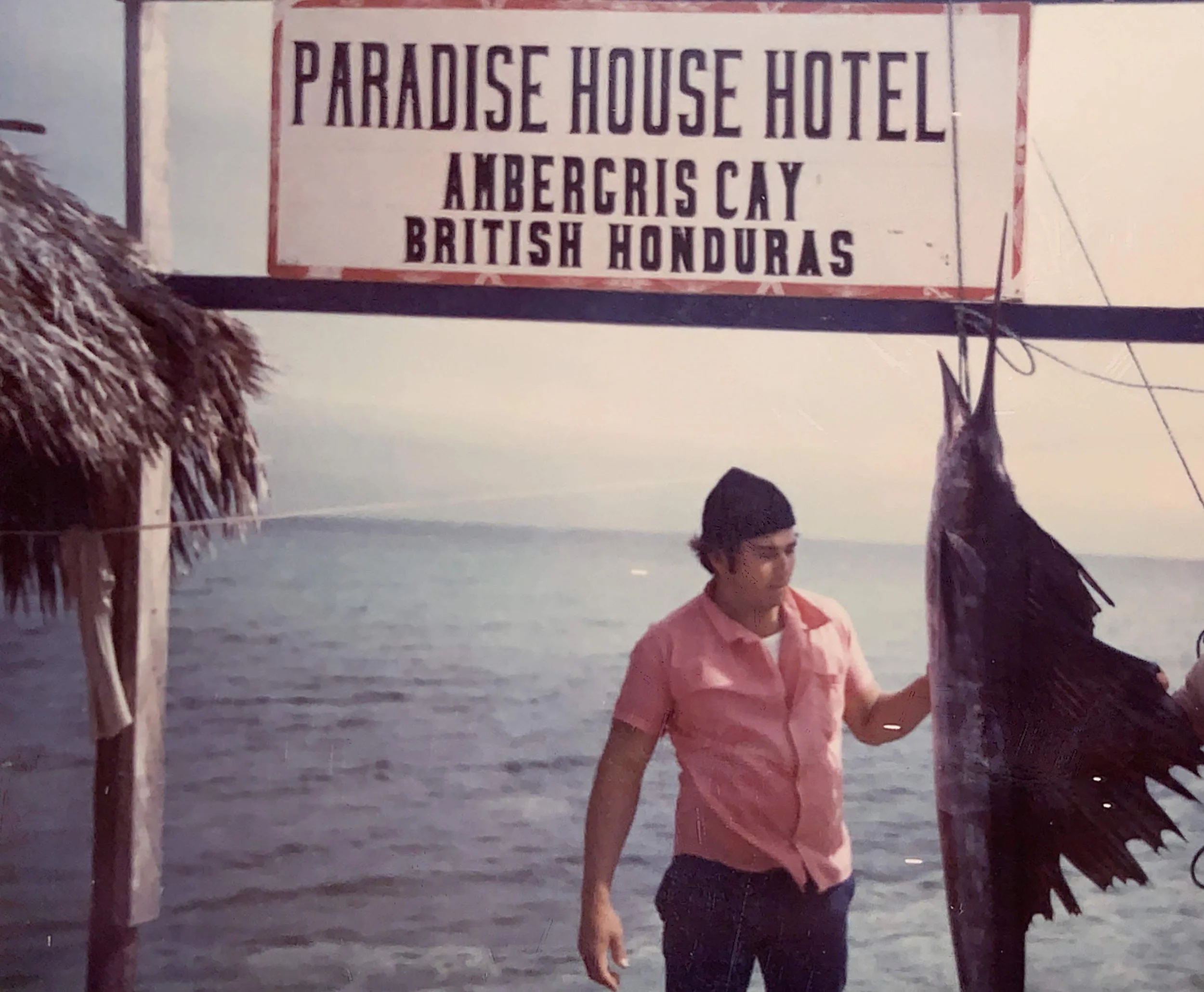 Early days of adventure: A guest celebrates a successful day on the water at the original Paradise Hotel.