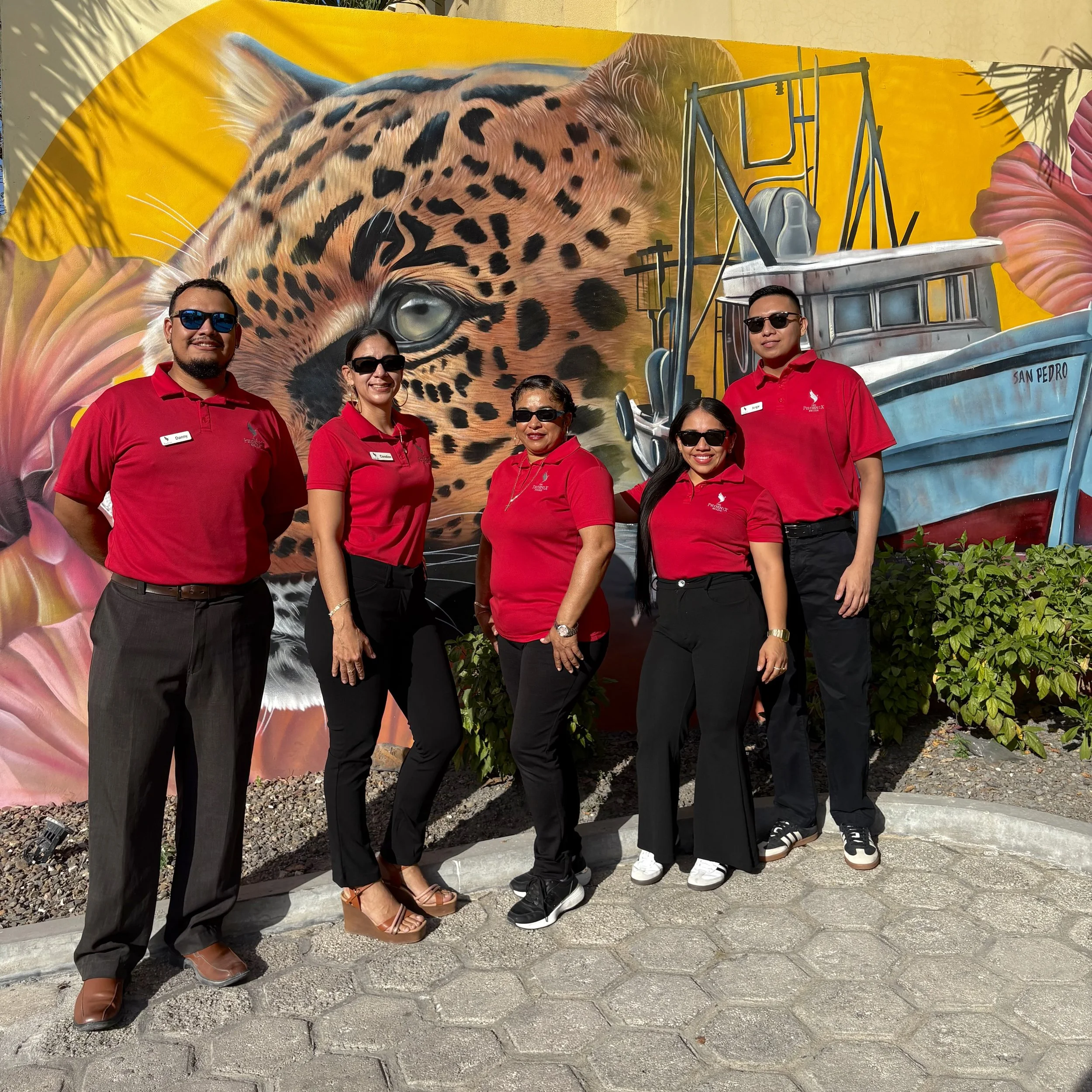 The friendly professional staff and hospitality team at The Phoenix Resort in San Pedro, Belize, dedicated to guest services and local island expertise.