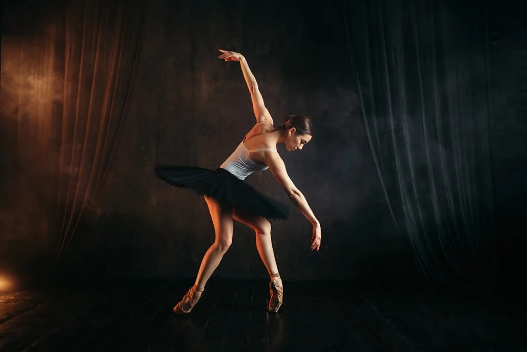 elegance-ballerina-in-action-on-theatrical-stage-PMT23KF-1030x688.jpg