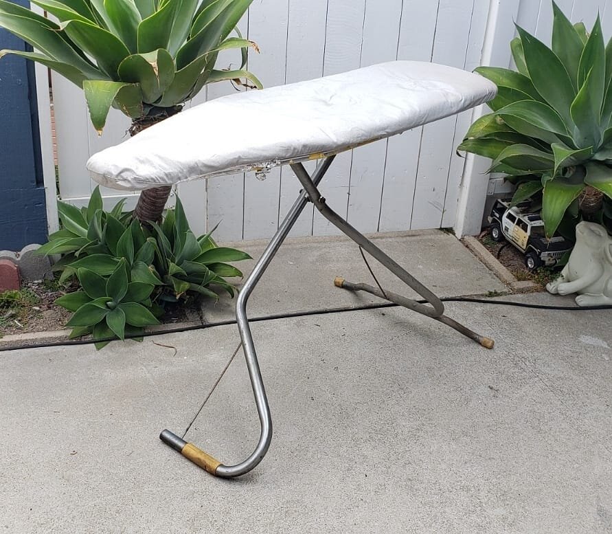 $50. 1950s vintage Rid-Jid ironing board. This metal ironing board features a tapered mesh top. Works great. 
Plus tax.
This item is located in my Antique Mall booth in the city or Orange. Text Message (don't call) for address and hours. 

#orangecir