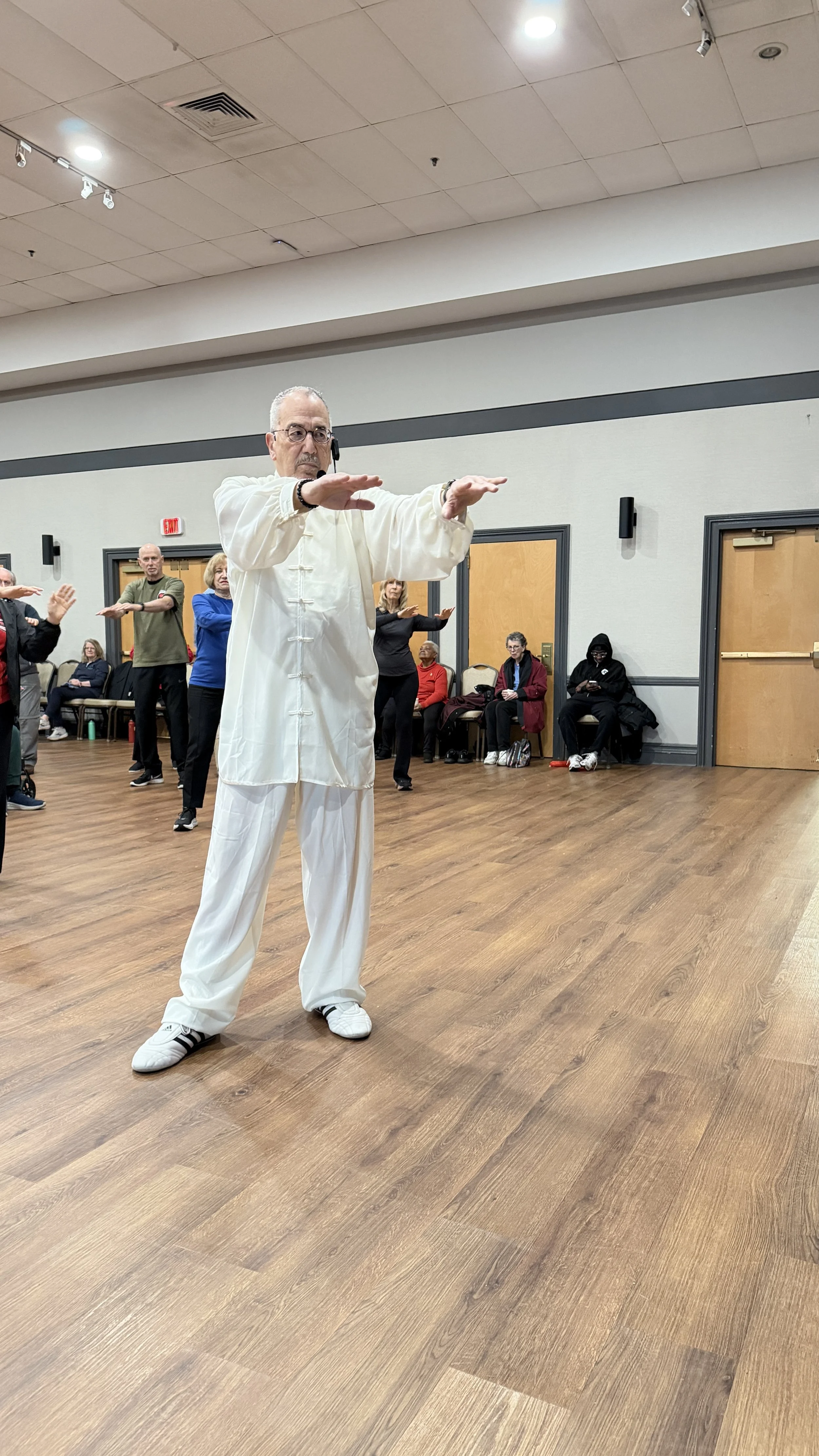 Morris leading students in a sword form