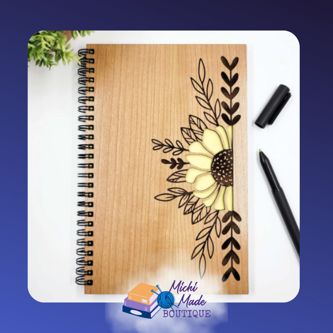 Sunflower – Wood journal with engraved sunflower and leaves, petals filled with bright yellow accents.