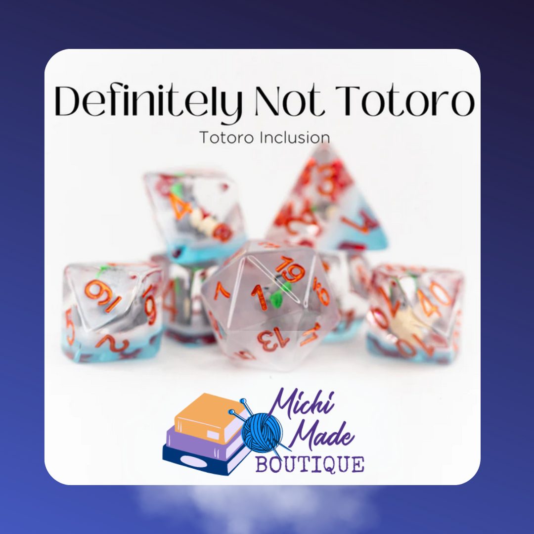 Clear dice with Totoro-like inclusion, orange numbers – Definitely Not Totoro set.