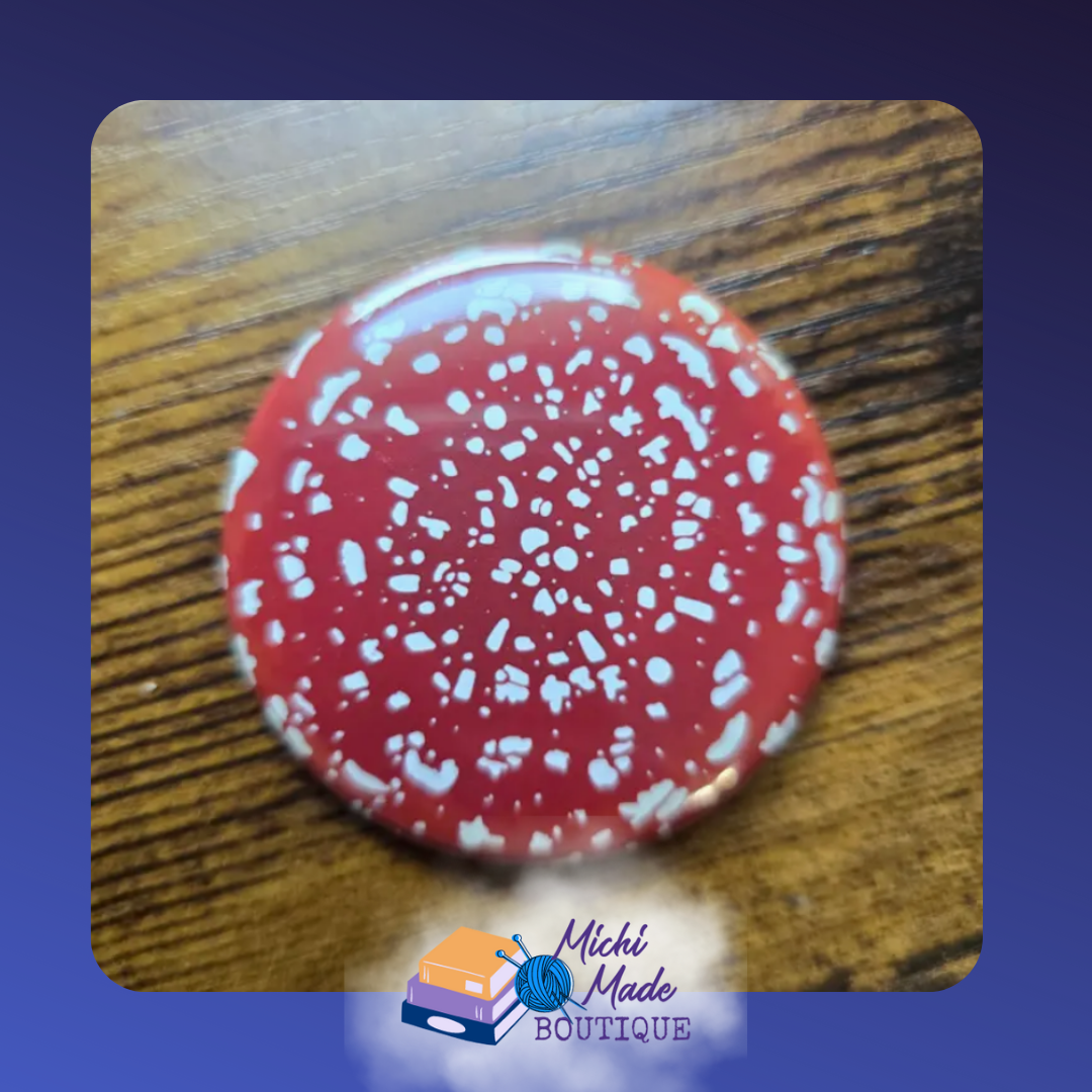 Amanita Red & White Mushroom Fridge Magnet – Red-capped white-spotted mushroom illustration on a white round magnet.