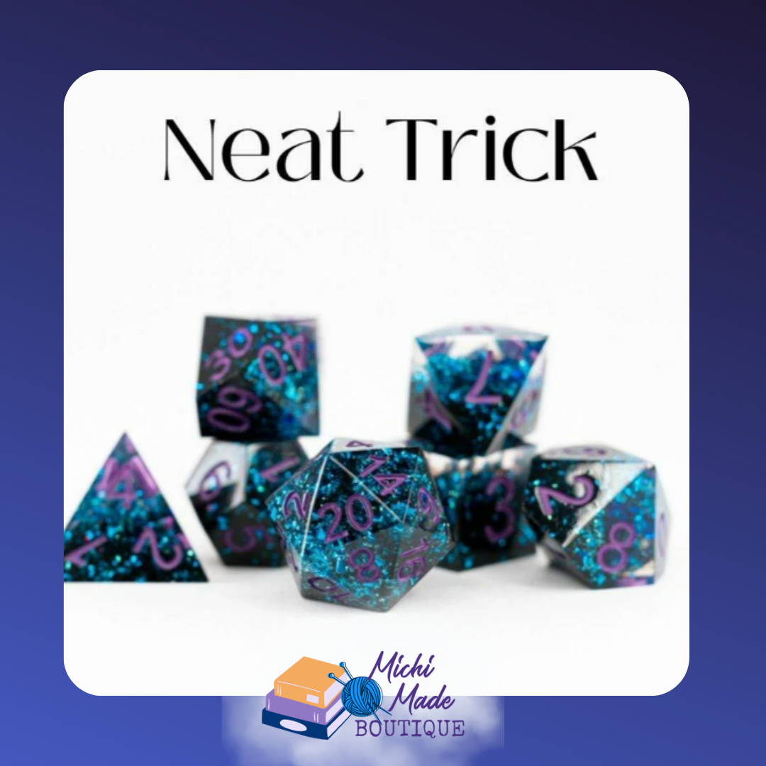 Neat Trick — Black and white resin dice with teal glitter inclusions and purple numbering on a white background.