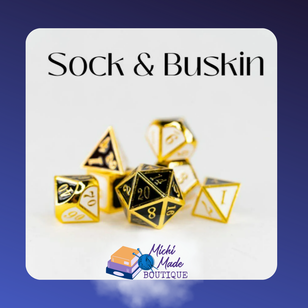 Sock & Buskin – Gold 7-piece RPG dice set with black and white faces, dramatic as comedy and tragedy masks.