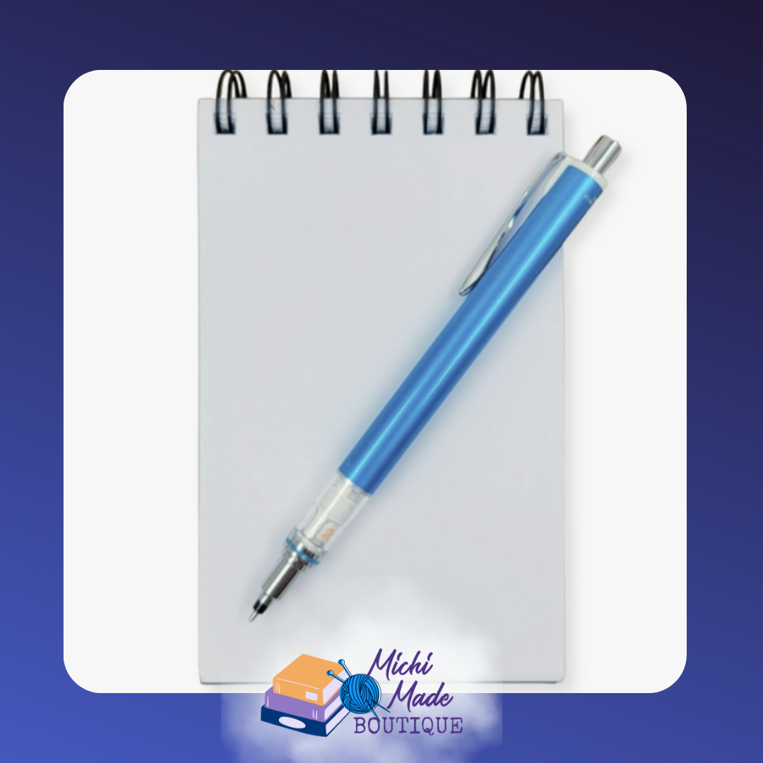 Small spiral notepad with blank white cover and blue pen on top.