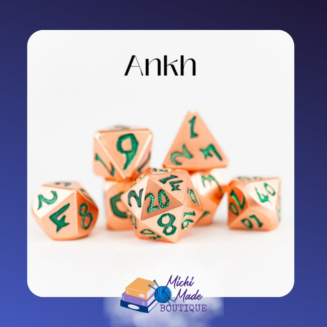 Ankh – Rose-gold metal dice with shimmering green numbers, bold and regal in design.