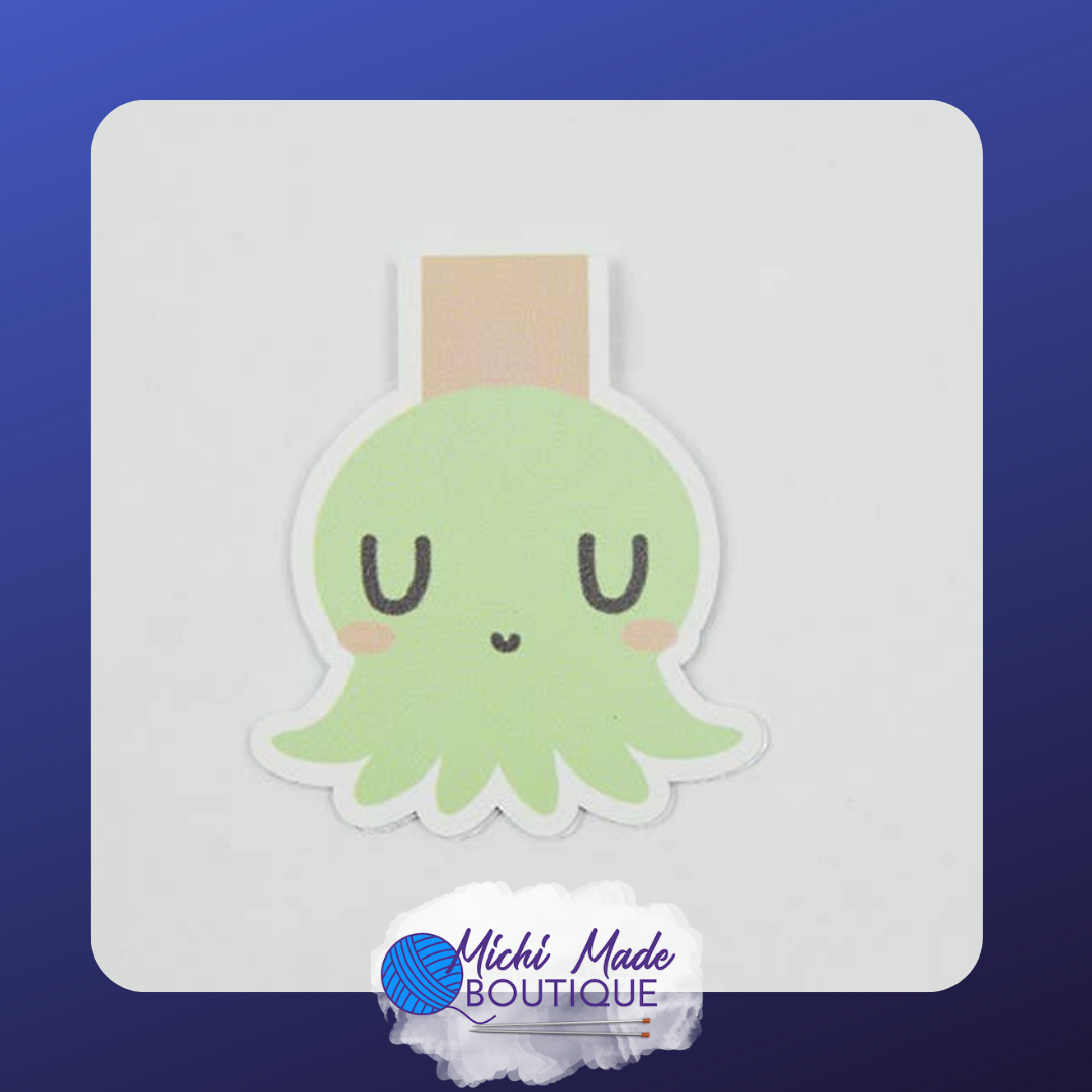 Cute green octopus-shaped magnetic bookmark with sleepy eyes and a light tan strap