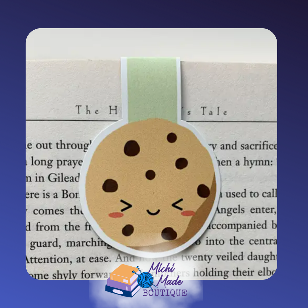 Smiling chocolate chip cookie magnetic bookmark with blushing cheeks and a mint green strip.