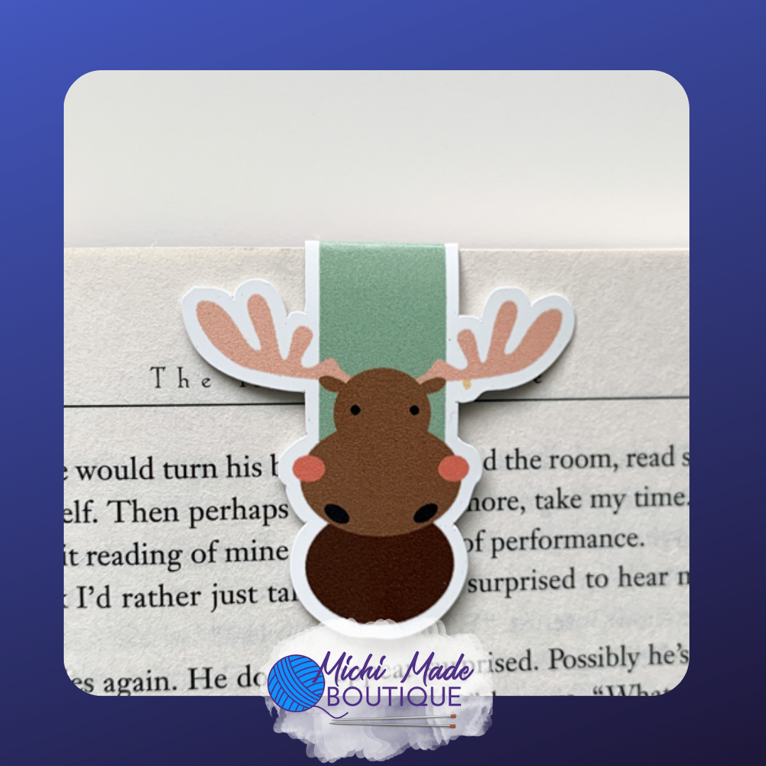 Cartoon moose magnetic bookmark with big antlers and blushing cheeks.