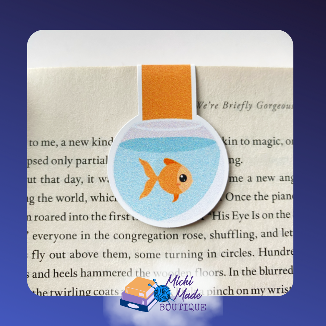 Round fishbowl magnetic bookmark featuring an orange goldfish and an orange strap.