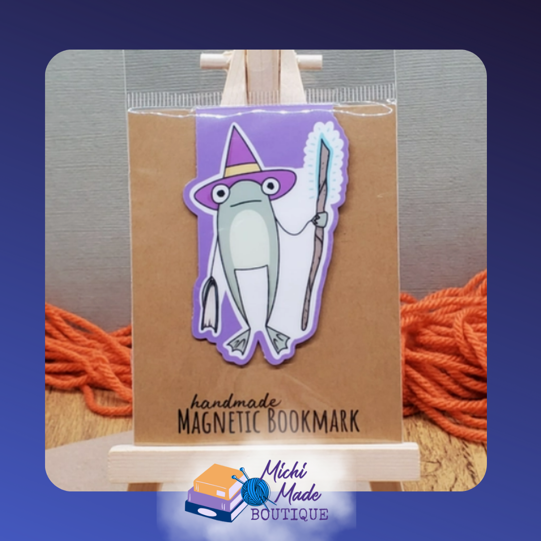 Frog in purple wizard hat holding staff.