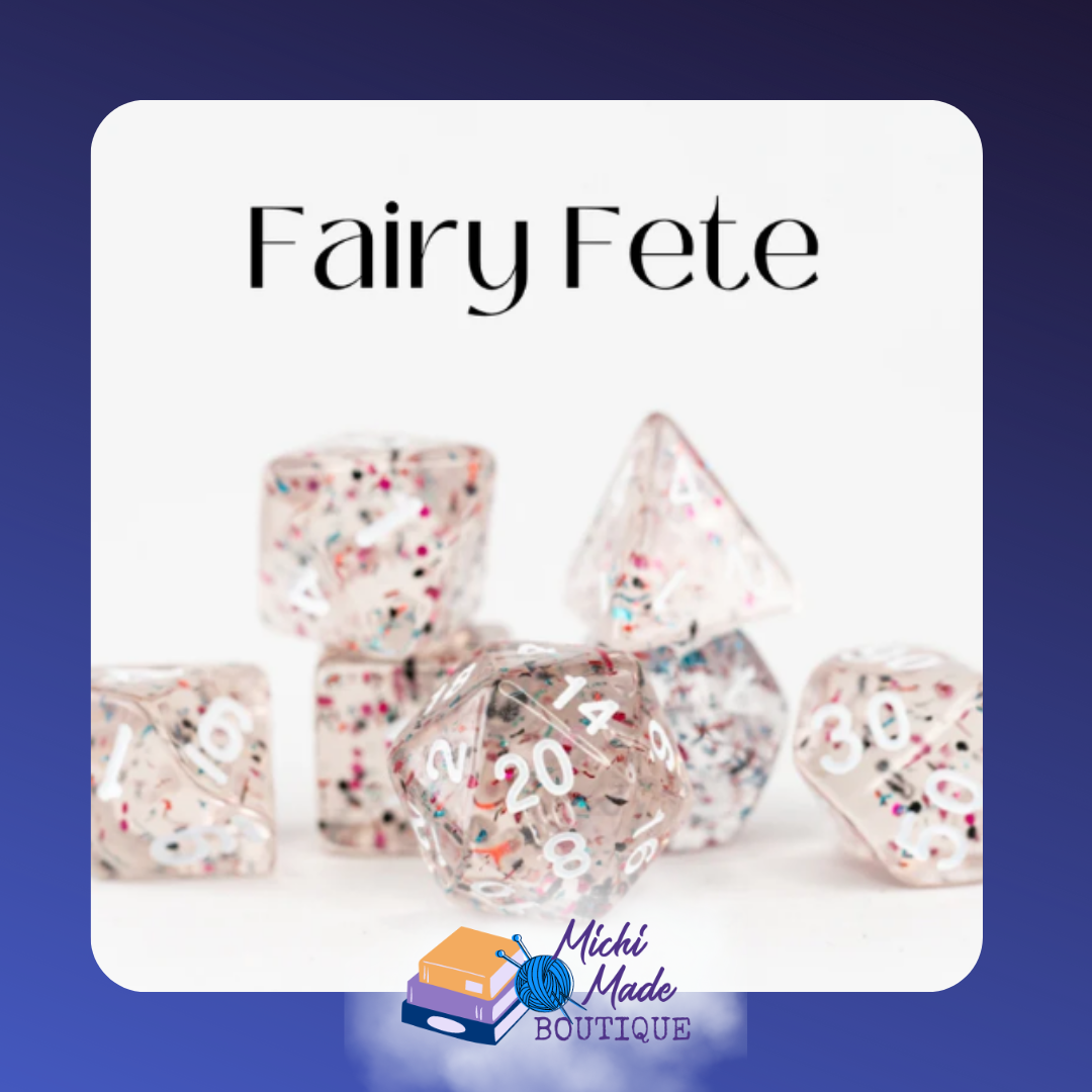 Fairy Fete: “Crystal-clear acrylic dice with multicolor confetti and white numerals.”