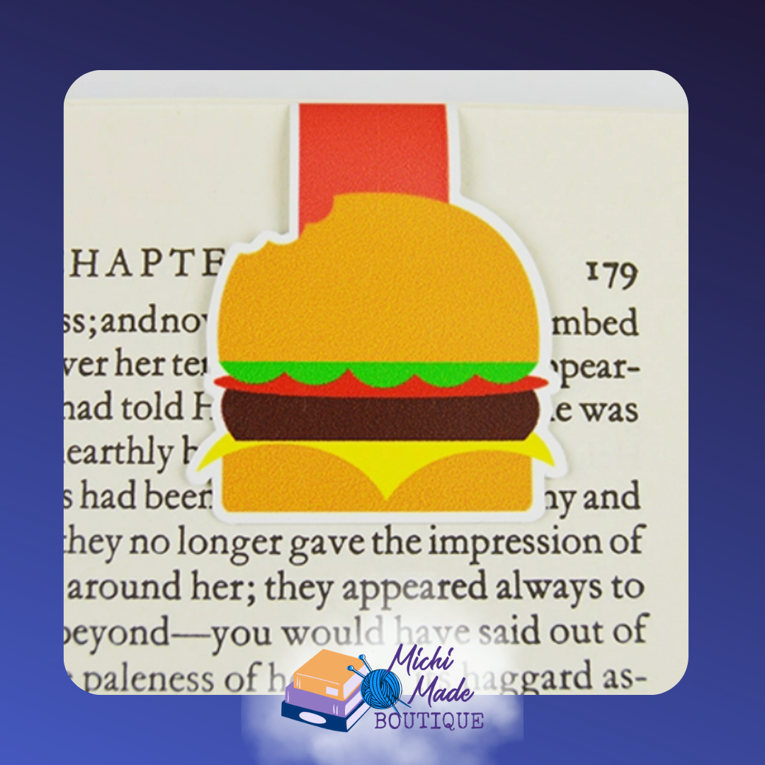 Burger-shaped magnetic bookmark with a bite taken out, layered with lettuce, cheese, and patty.