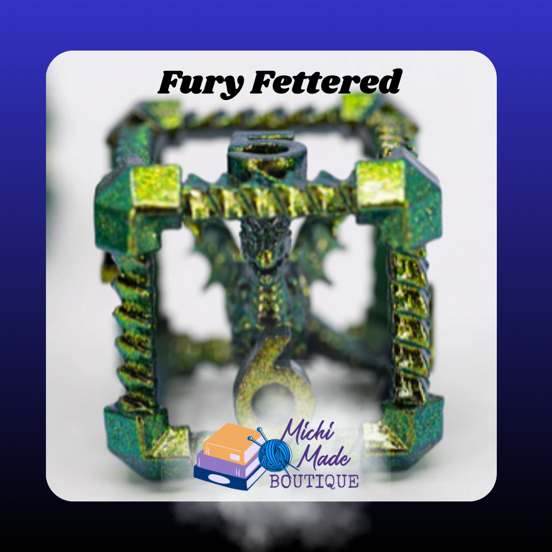 Fury Fettered – D6 Close-Up Macro close-up of the green-and-gold D6, highlighting the dragon curled inside the cubic metal frame.