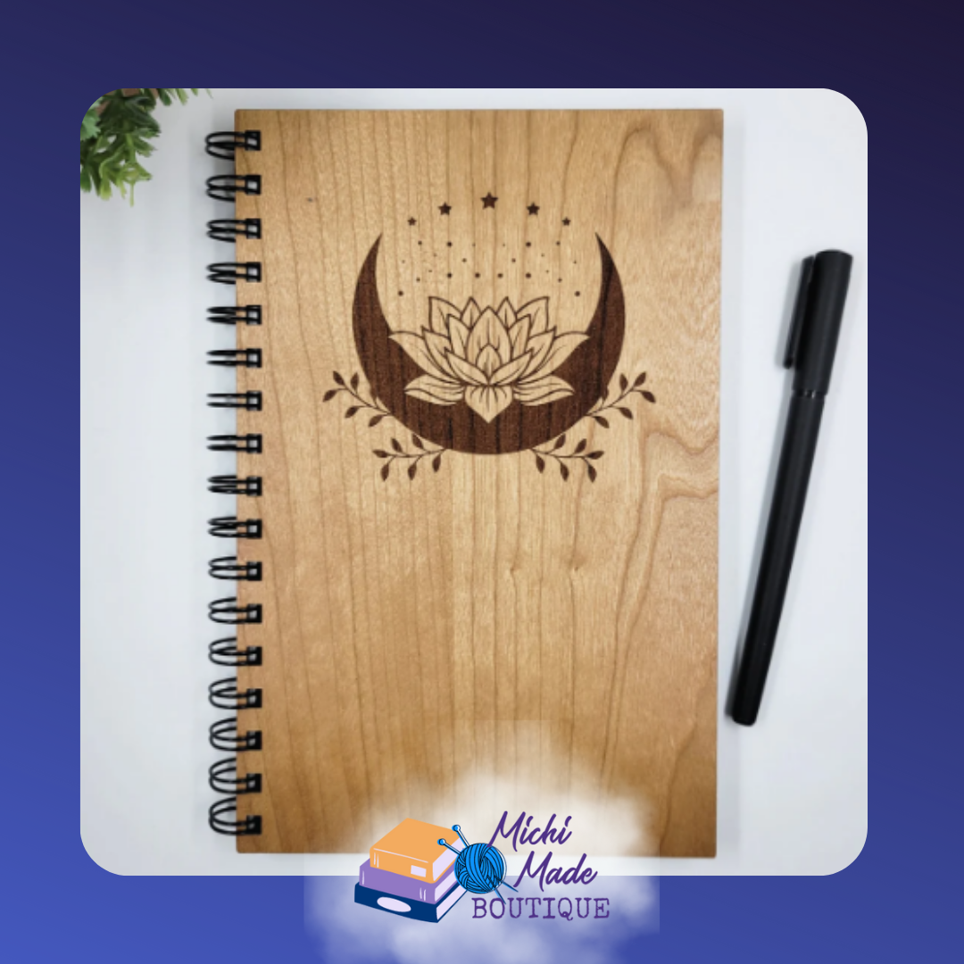 Lotus Moon – Wood journal with engraved crescent moon and lotus flower surrounded by stars and foliage.