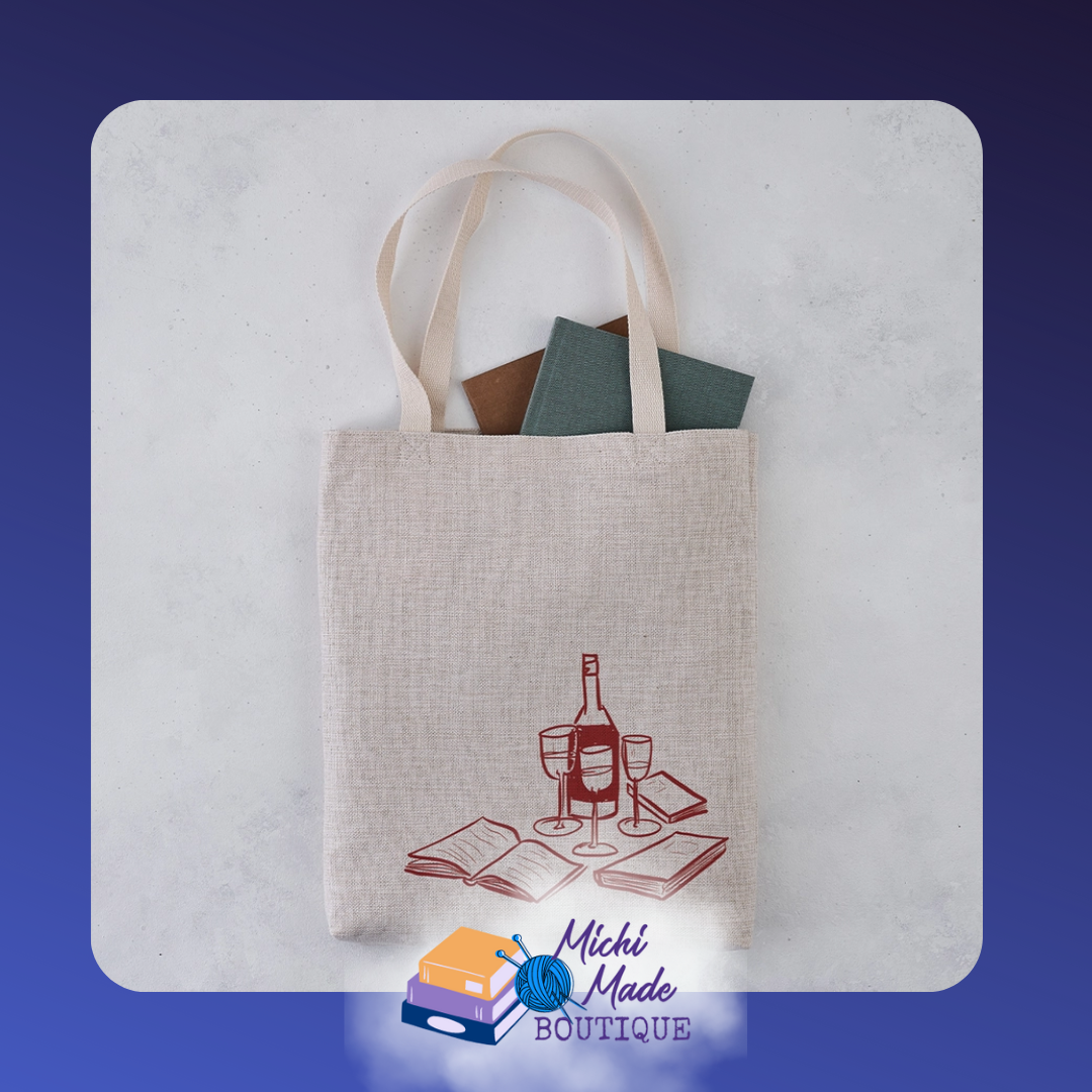 Canvas tote featuring illustration of stacked books and a glass of wine.