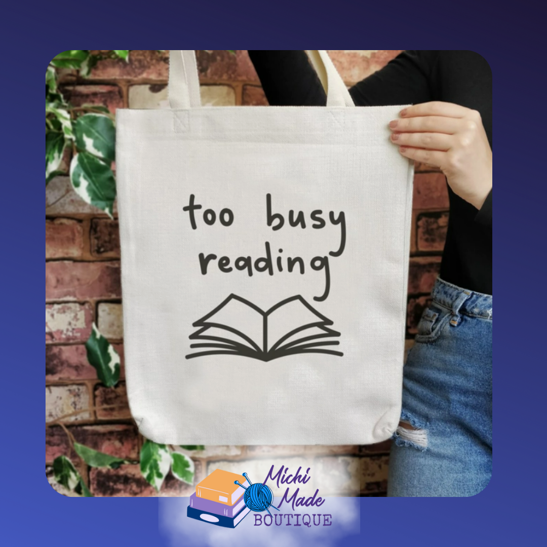 Canvas tote with cheeky phrase “Too Busy Reading” in playful lettering.