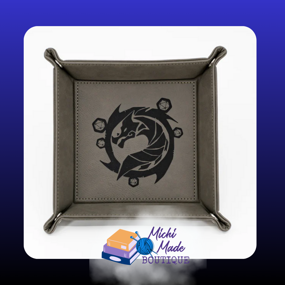 Grey tray engraved with stylized dragon and polyhedral dice circle.
