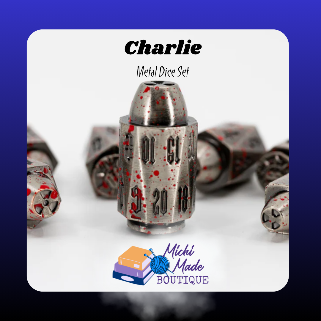 Charlie – D20 Close-Up  “A bullet-shaped metal D20 in iron gray with red splatter accents and engraved black numbers shown upright on a white background.”