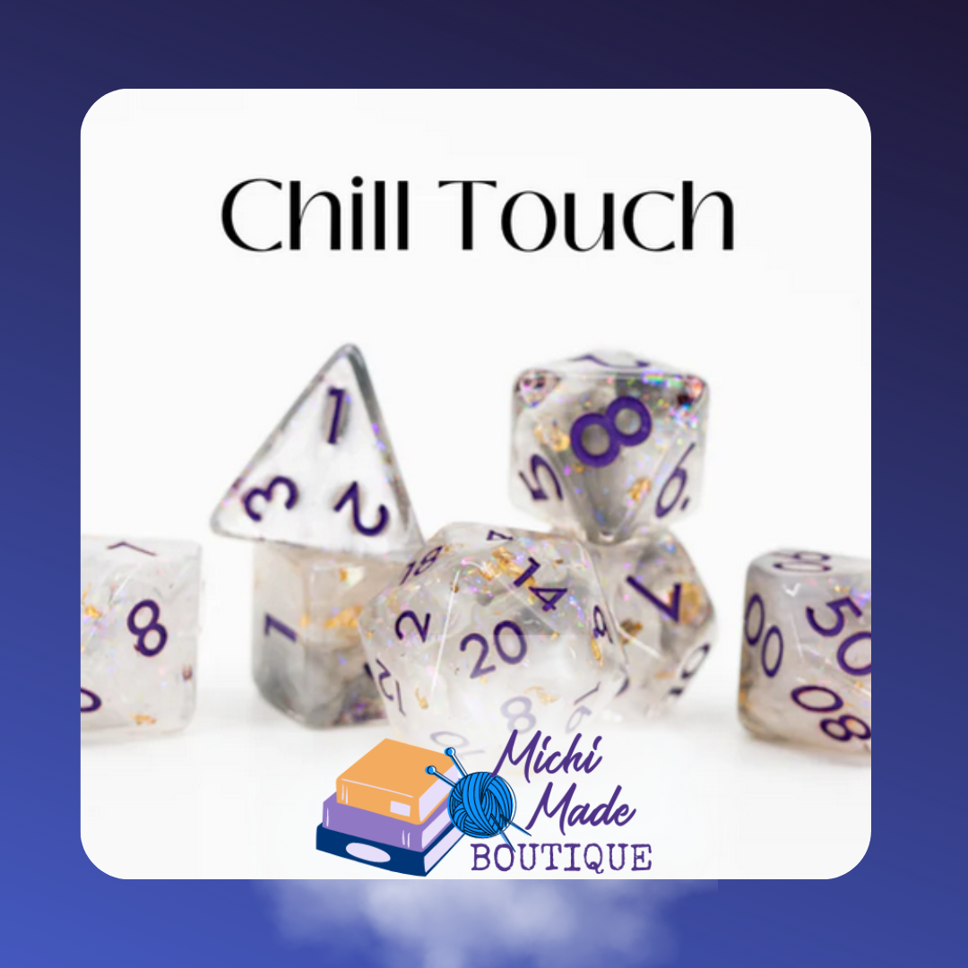 Chill Touch: “Clear acrylic dice with purple numerals, iridescent glitter, and gold-foil flakes.”