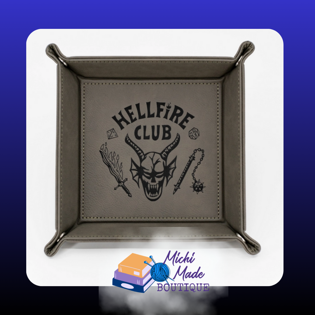 Grey tray engraved with “Hellfire Club” and demonic symbols.