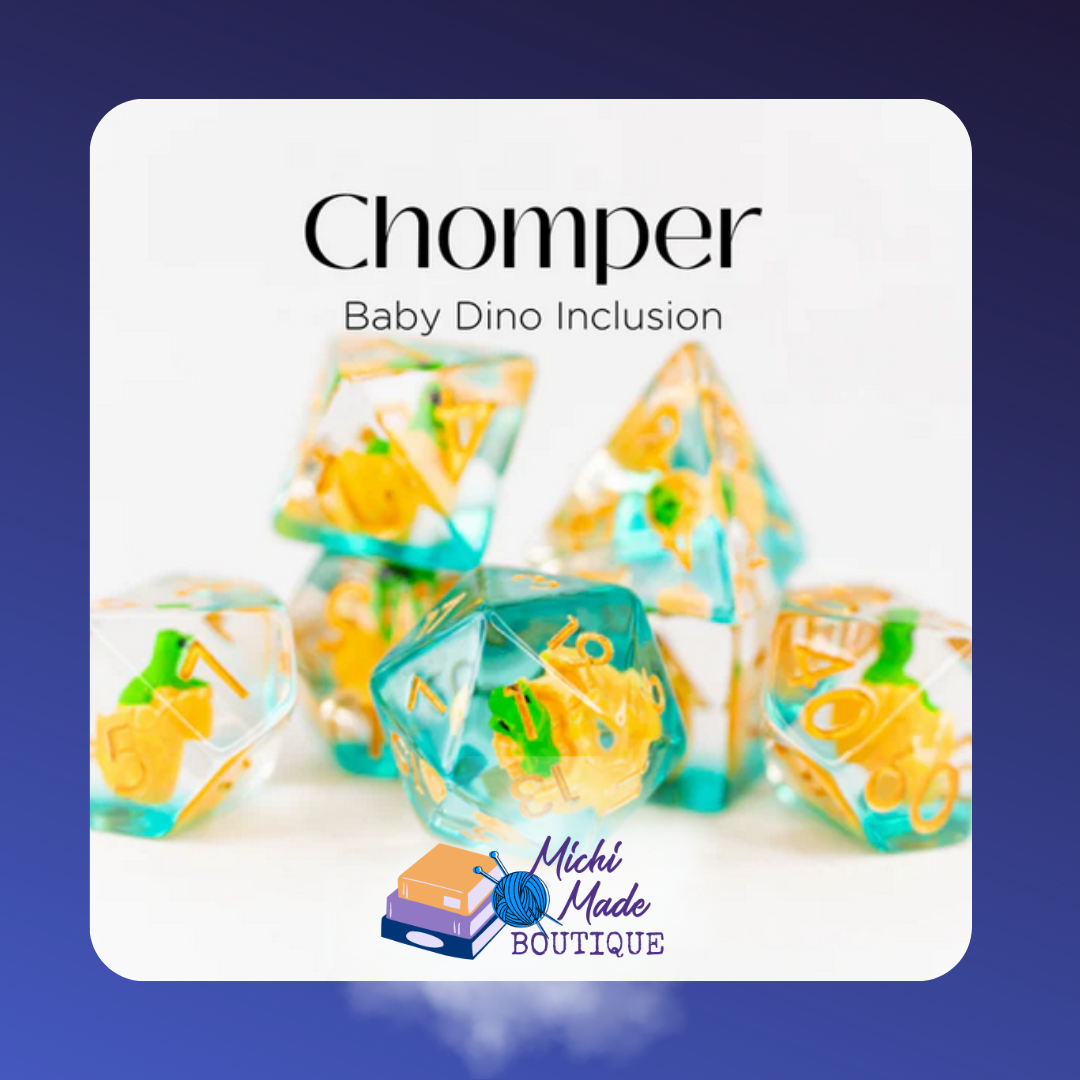 Clear teal dice with yellow baby dino inclusions, orange numbers – Chomper set.