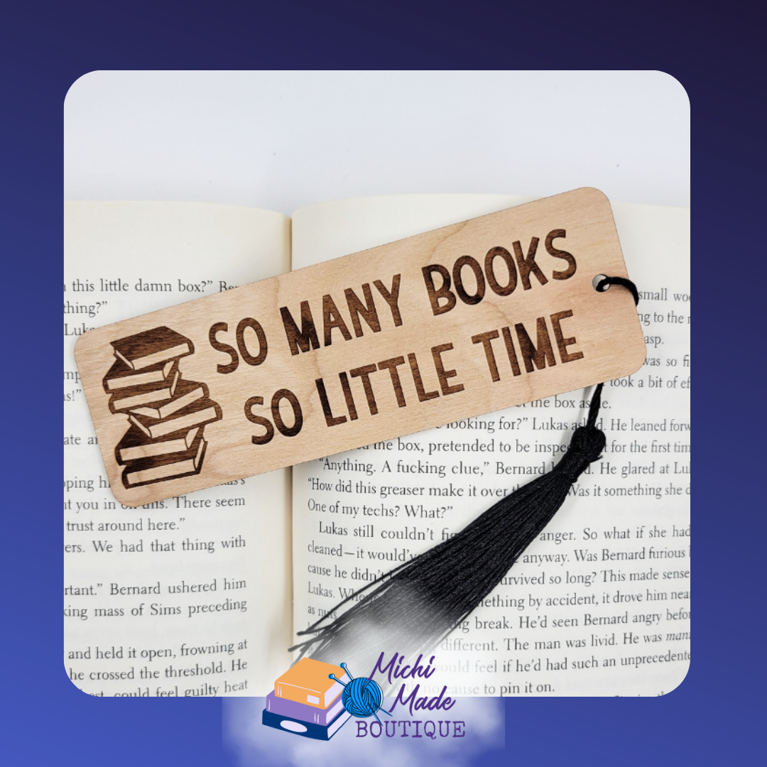 Wooden bookmark with “So Many Books So Little Time” text and stacked books design, black tassel attached.