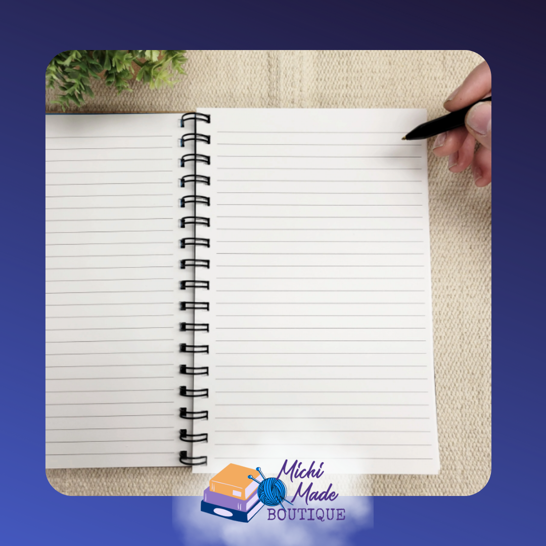 Open spiral-bound journal showing blank lined pages ready for writing.