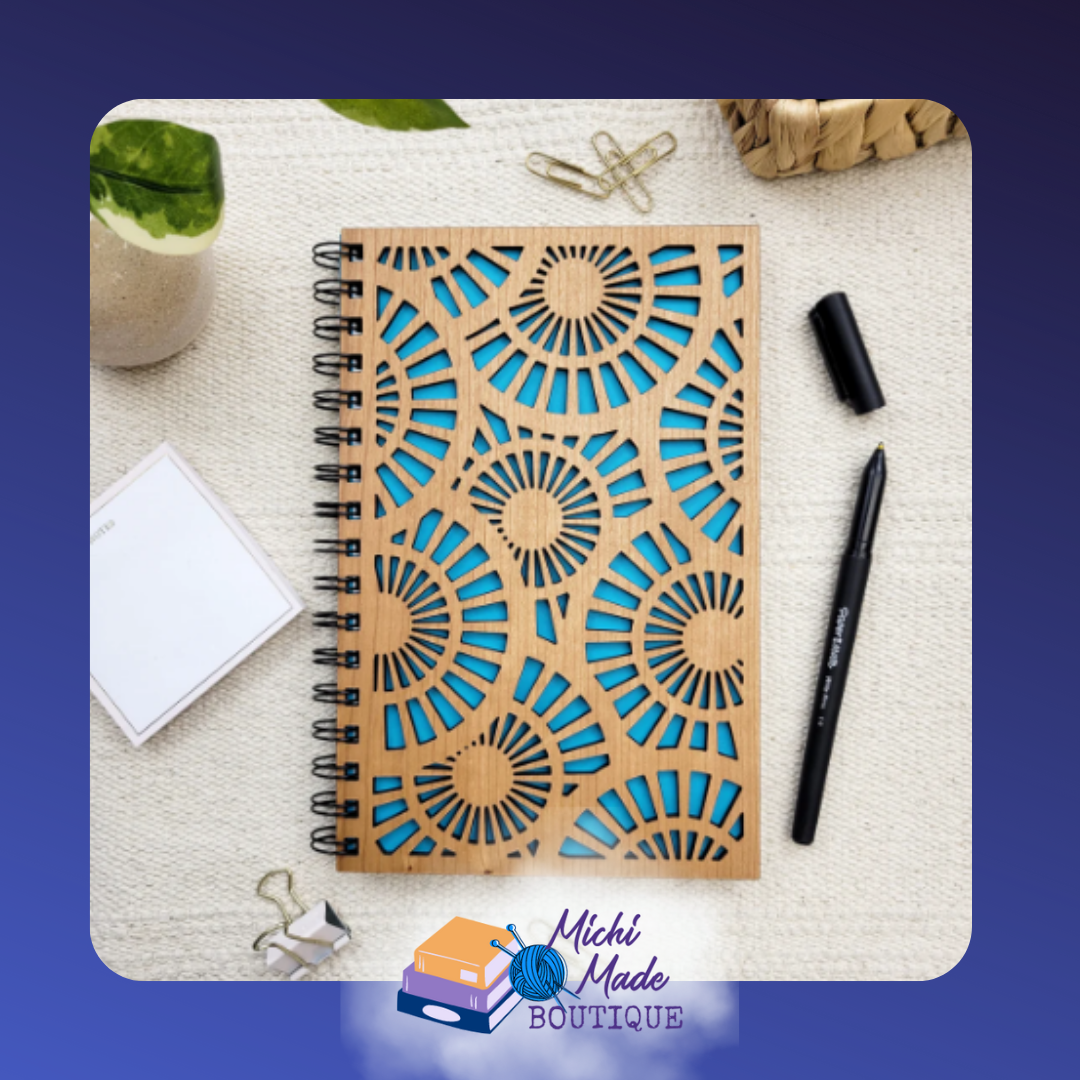 Zen Spirals – Wood journal with laser-cut geometric spiral pattern over bright blue backing.