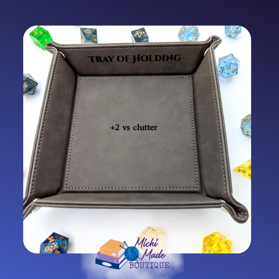 Grey tray engraved “Tray of Holding” with “+2 vs clutter.”